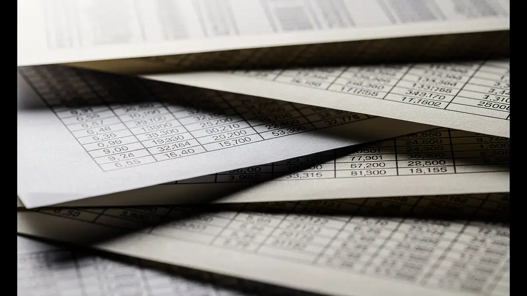 Extreme close-up of complex spreadsheet printout showing overwhelming data density