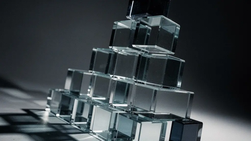 A precarious and unstable pyramid of glass blocks, symbolizing the accumulating and hidden debt of uncollected sales tax.
